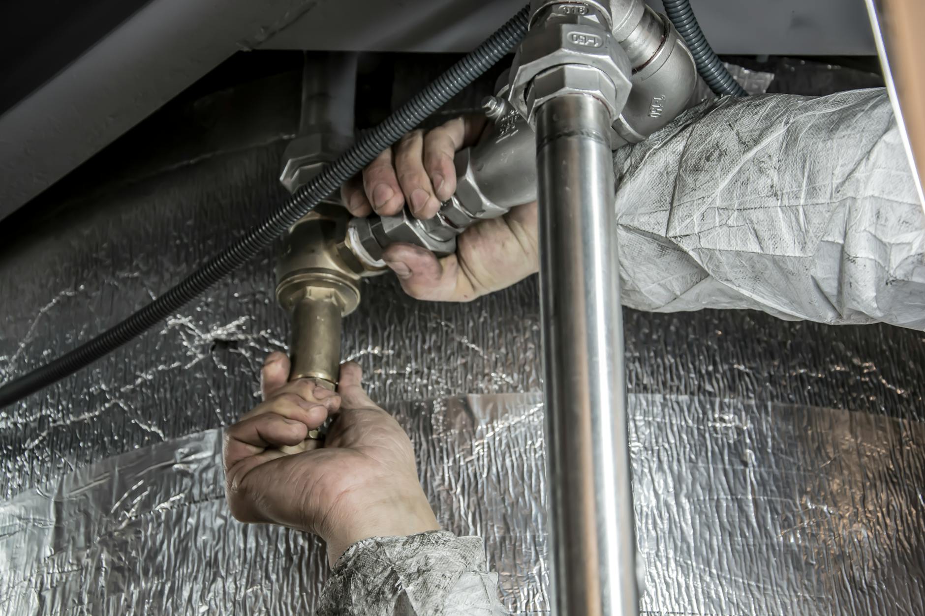 Professional plumber at work